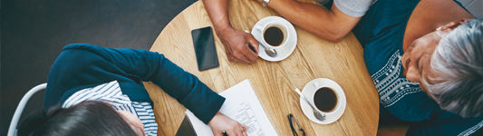 overhead view of coffee meeting