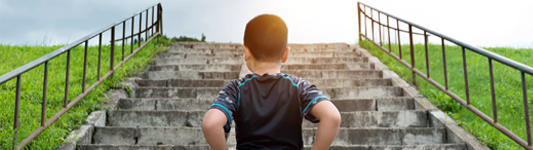 child running up stairs