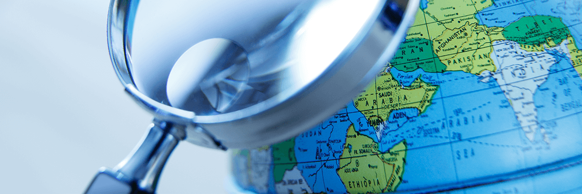 magnifying glass and globe