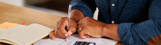 man writing calculation